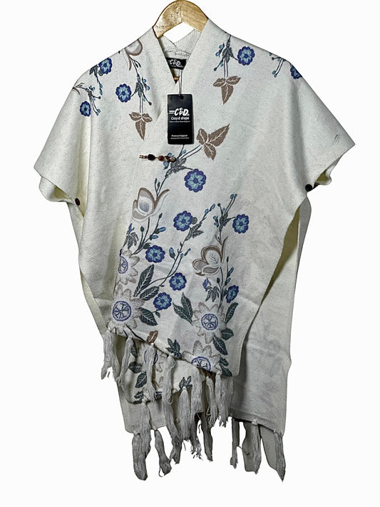 Cozy&Drape cream winter cape shawl with blue and brown floral embroidery and decorative fringe hem