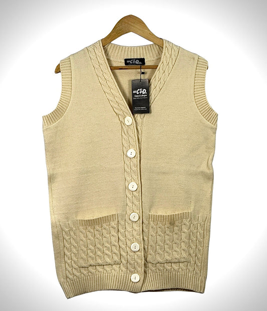 Cozy&Drape sleeveless cardigan sweater in cream with cable knit details, front buttons, and two patch pockets.