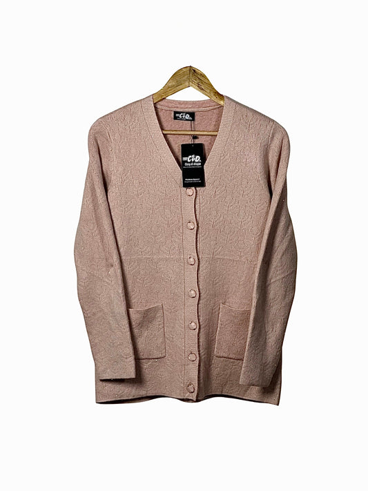Cozy&Drape blush pink wool cardigan sweater with long sleeves, button front, and two patch pockets on a hanger.