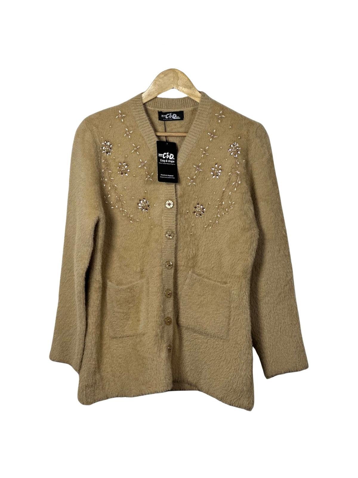 Cozy&Drape beige full sleeve cardigan sweater with floral bead embellishments and front pockets on a wooden hanger