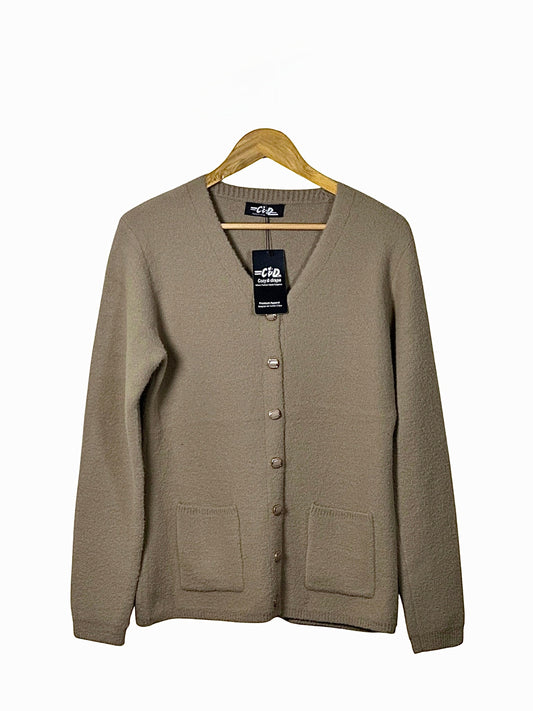 Cozy&Drape beige full-sleeve cardigan sweater with front pockets and button-down closure on a wooden hanger