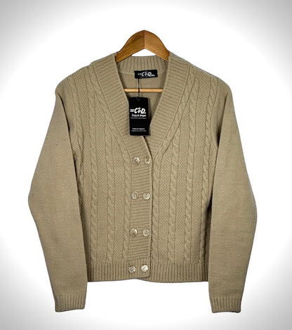 Cozy&Drape beige cable knit extra short cardigan sweater with a V-neck and button-up front on a wooden hanger