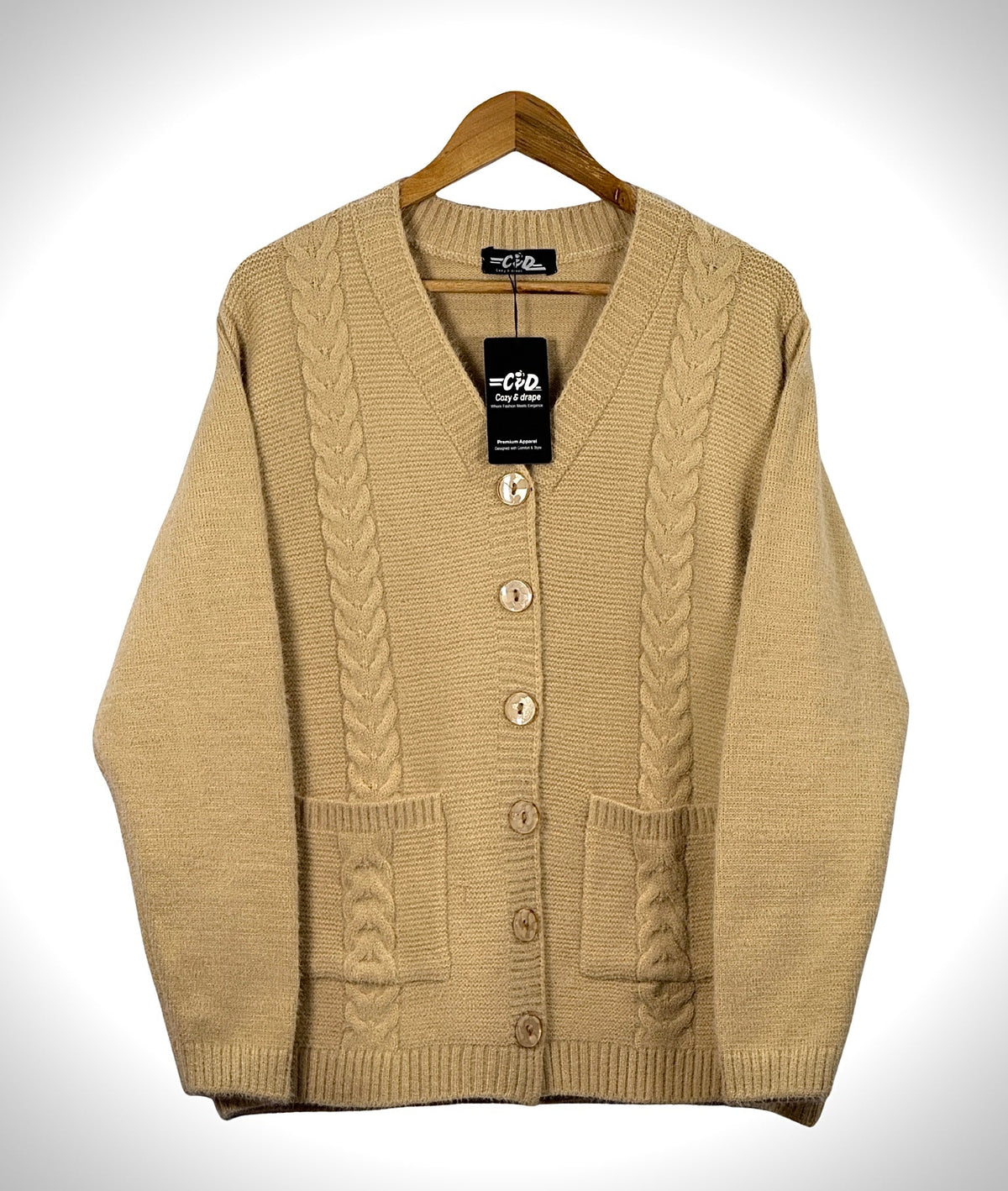Cozy&Drape beige cable knit cardigan sweater with long sleeves, front button closure, and two patch pockets.