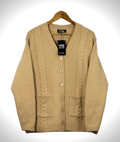 Cozy&Drape beige cable knit cardigan sweater with long sleeves, front button closure, and two patch pockets.