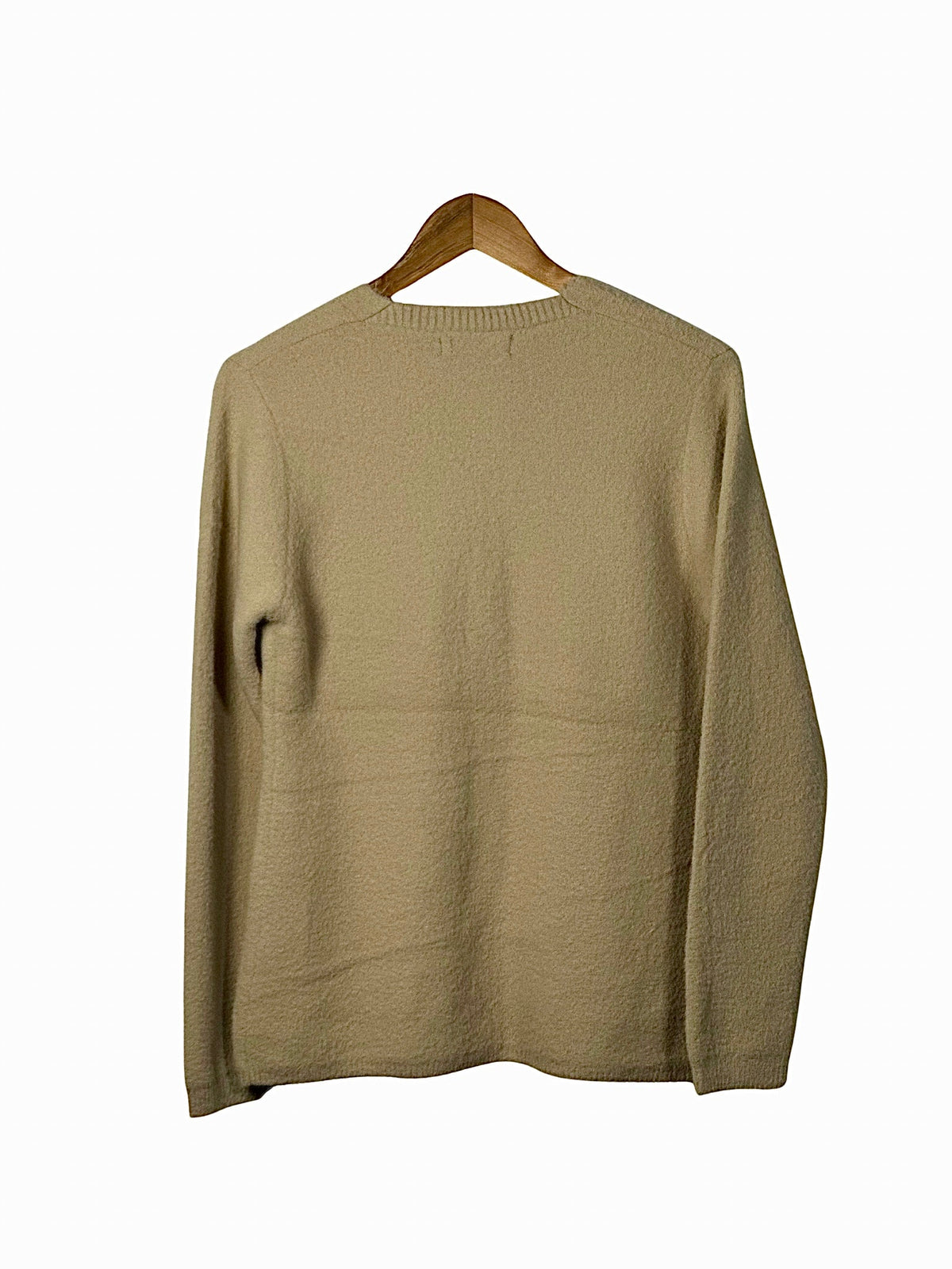 Cozy&Drape beige full sleeve cardigan sweater with a textured knit finish hanging on a wooden hanger