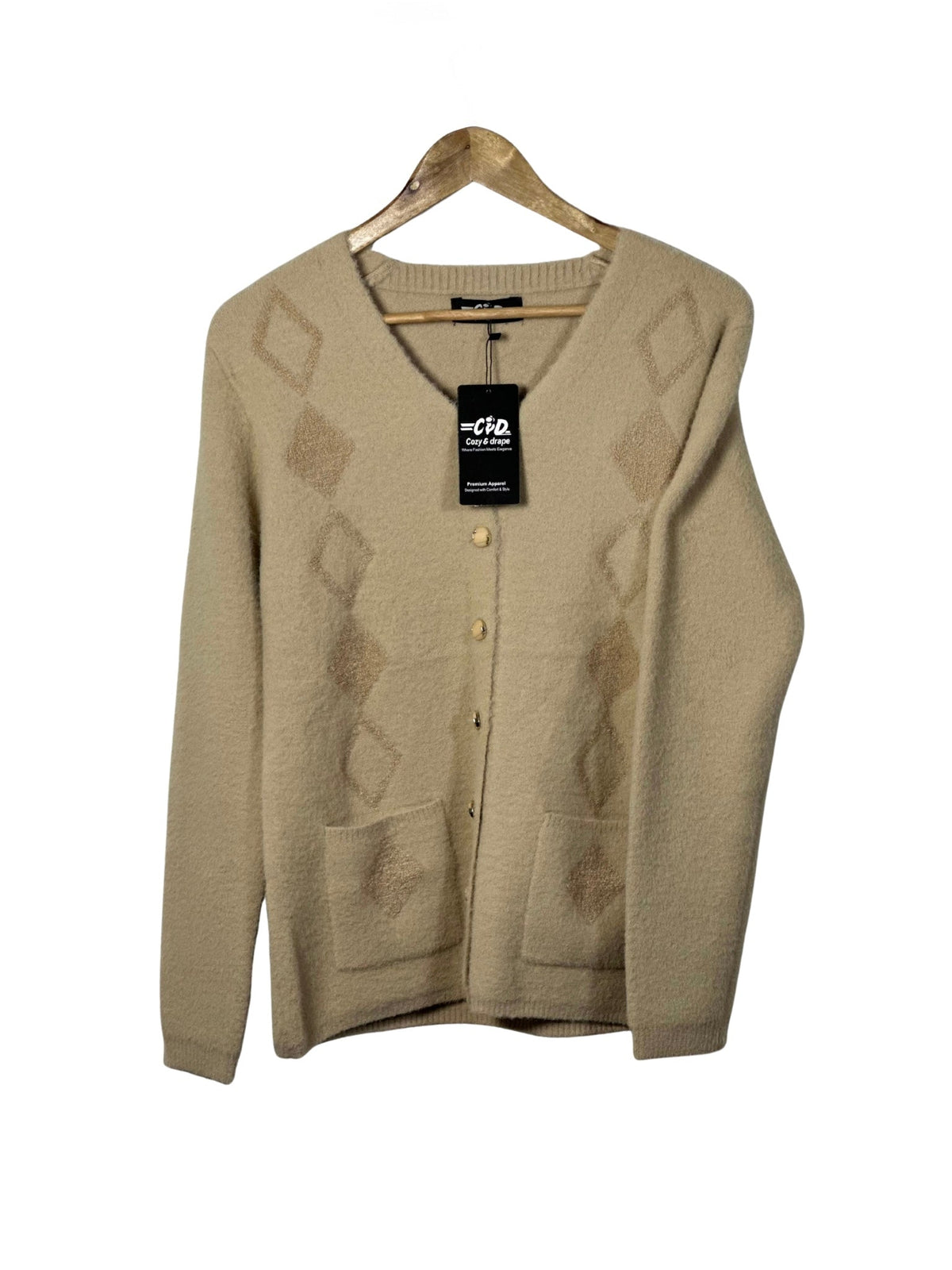 Cozy&Drape beige full sleeve cardigan sweater with diamond pattern, front buttons, and pockets on a wooden hanger.