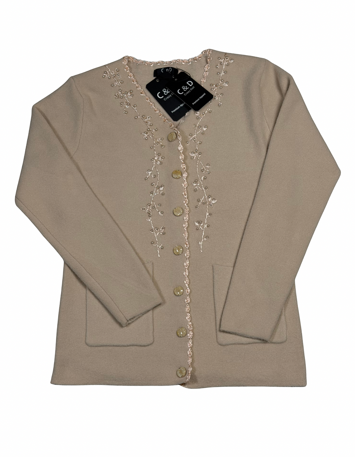 Cozy&Drape beige knit cardigan with V-neck, floral embroidery along the button placket, and two front pockets.
