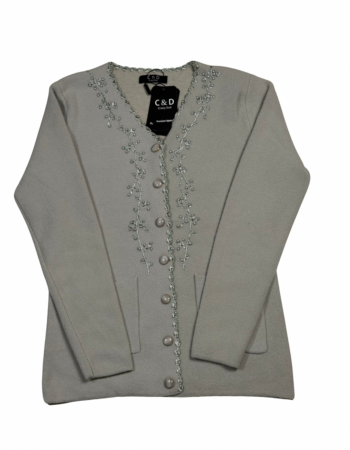 Cozy&Drape beige V-neck knit cardigan with delicate silver floral embroidery along the button placket and front pockets.