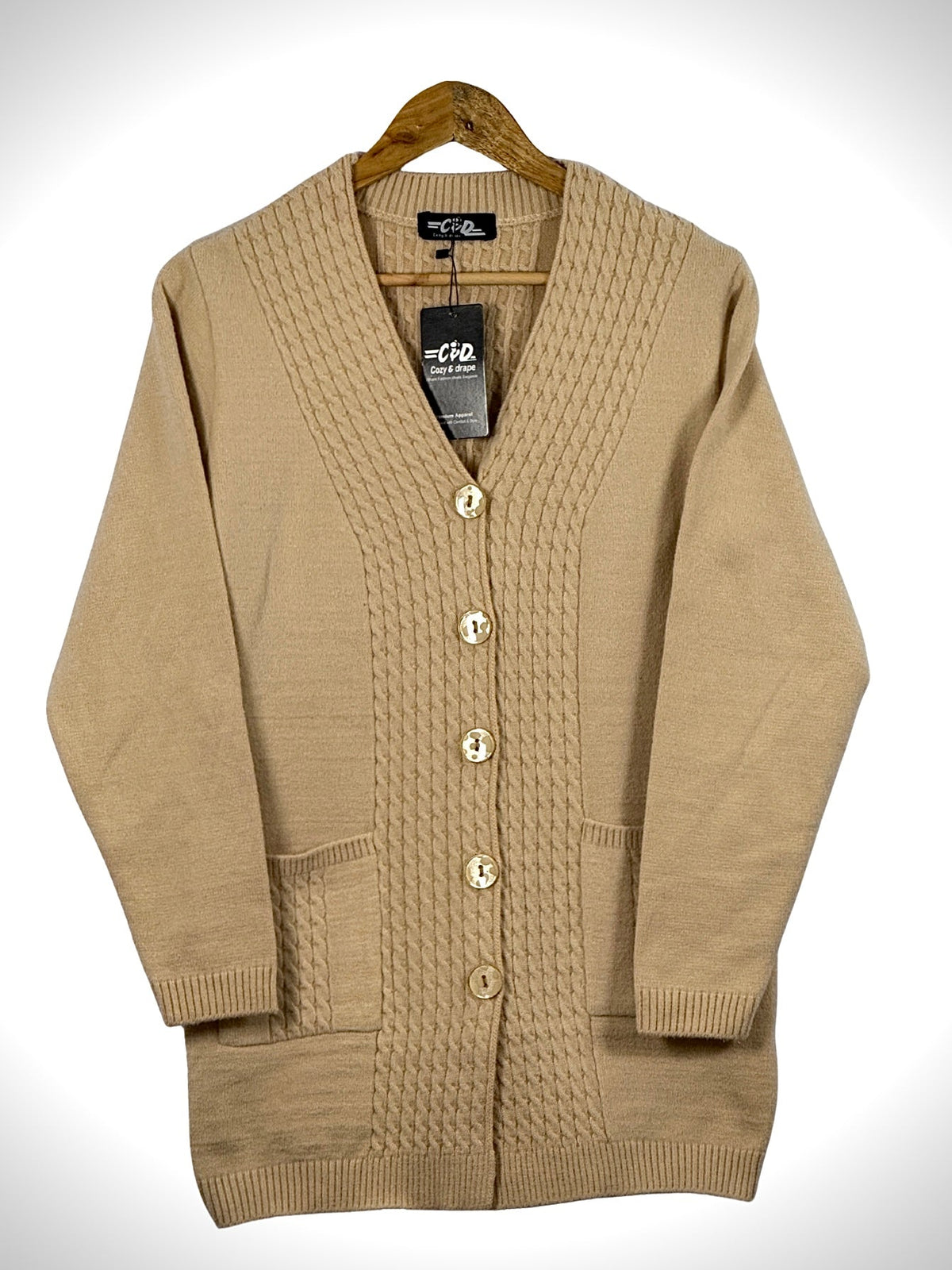 Cozy&Drape beige long cardigan sweater with cable knit front panels, button closure, and two front pockets.