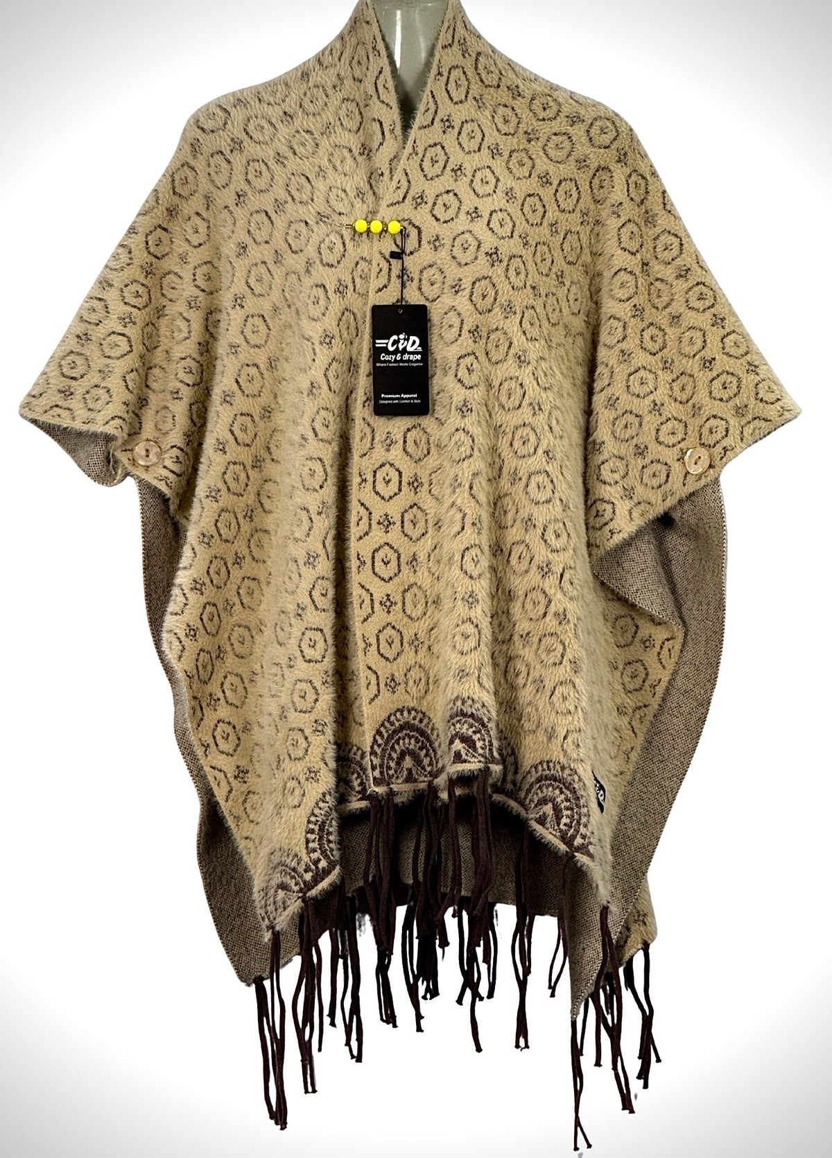 Cozy&Drape beige patterned winter cape shawl with fringe hem, button details, and premium knit texture