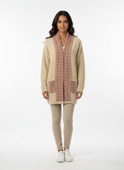 Model wearing a Cozy&Drape beige fuzzy knit cardigan with a patterned muffler-style front and pearl brooch closure.