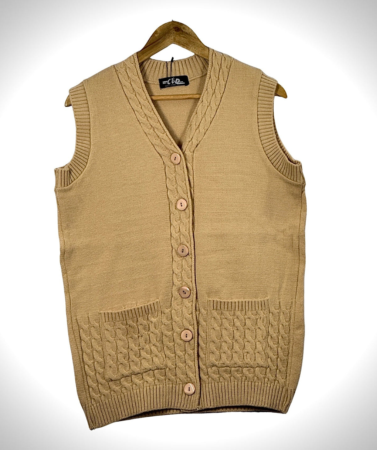 Cozy&Drape sleeveless cardigan sweater in beige with a V-neck, button front, and cable knit pocket details.