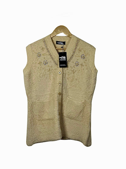 Cozy&Drape sleeveless knit cardigan in beige with V-neck, shimmering beadwork, embroidery, and front button closure.