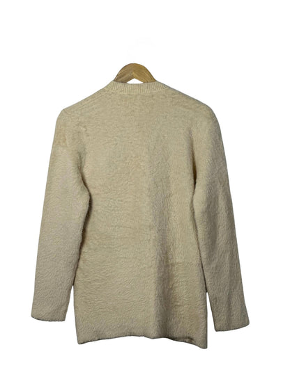 Cozy&Drape beige full sleeve cardigan sweater with a soft textured knit fabric on a wooden hanger