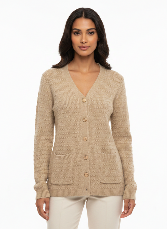 Model wearing a Cozy&Drape beige textured knit V-neck button-up cardigan with two front pockets.