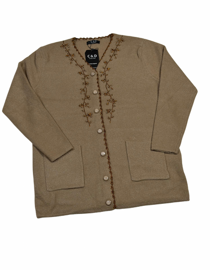 Cozy&Drape beige wool cardigan with front buttons, pockets, and delicate beaded embroidery along the V-neckline.
