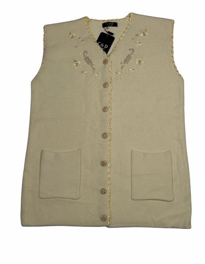 Cozy&Drape sleeveless wool cardigan in beige with front button closure, pockets, and delicate floral embroidery.