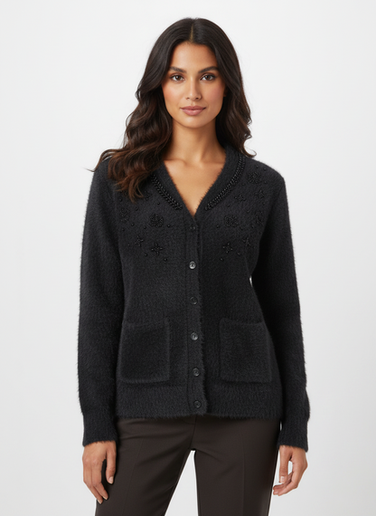 Cozy&Drape black fuzzy knit cardigan with beaded collar detail and front pockets worn by a woman