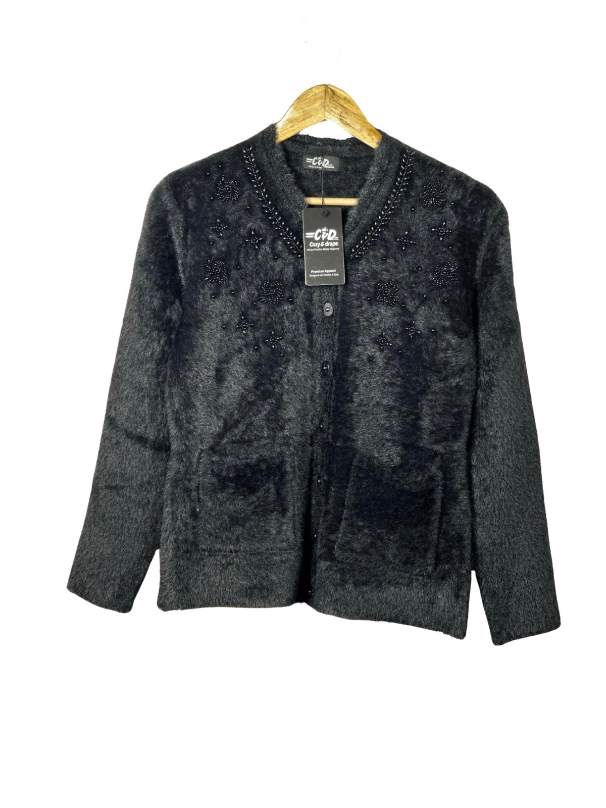 Cozy&Drape black fuzzy cardigan sweater with beaded floral embellishments, front pockets, and long sleeves.