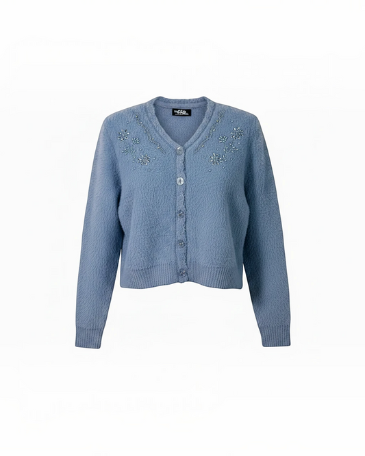 Cozy&Drape blue fuzzy knit cropped cardigan with V-neckline, floral beadwork embellishments, and front button closure.