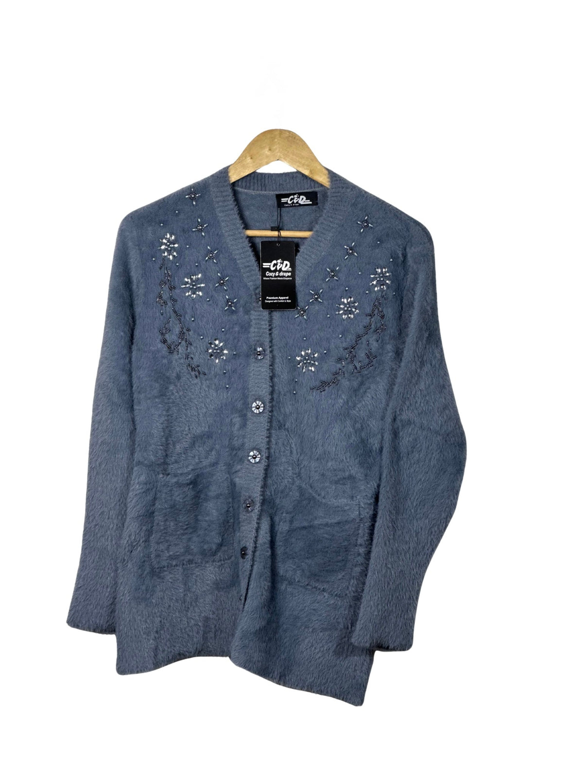 Cozy&Drape blue fuzzy full sleeve cardigan sweater with delicate floral beadwork and front pockets on a hanger