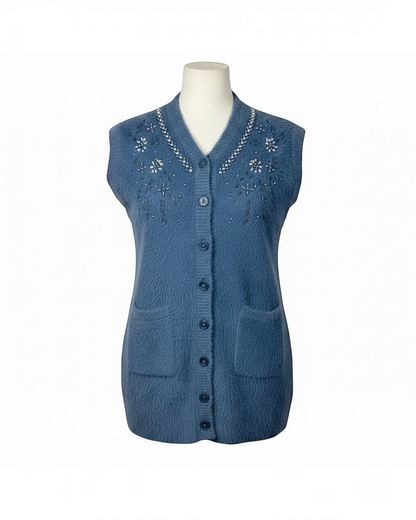 Cozy&Drape blue sleeveless knit cardigan vest with V-neck, delicate beadwork embroidery, and two front pockets.