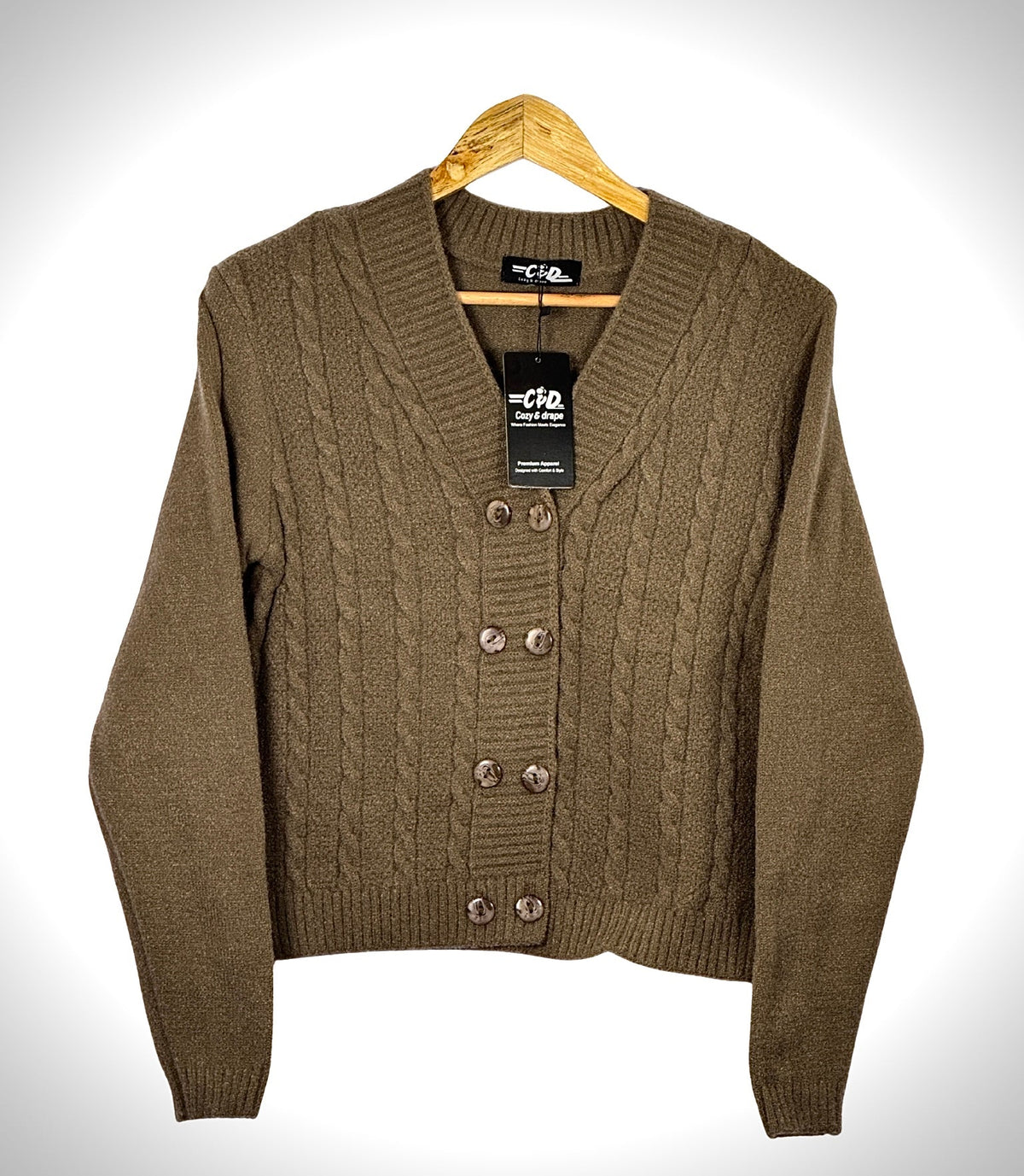 Cozy&Drape extra short brown cable knit cardigan sweater with a V-neck and four button closure on a wooden hanger