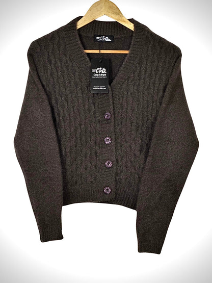 Cozy&Drape extra short brown cable knit cardigan sweater with decorative buttons on a wooden hanger
