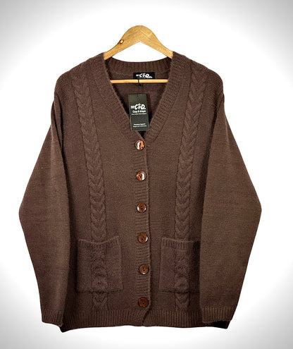 Cozy&Drape brown cable knit cardigan sweater with long sleeves, front buttons, and two pockets on a wooden hanger.