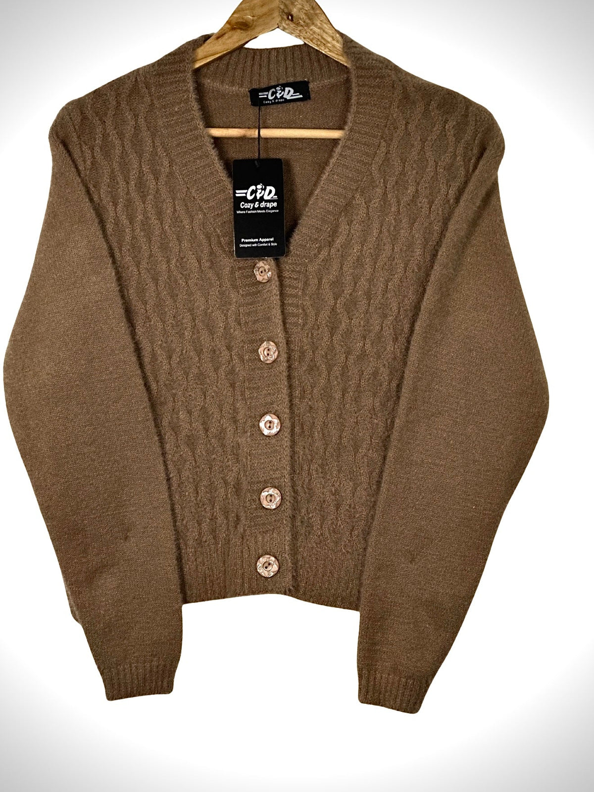 Cozy&Drape extra short brown cardigan sweater with a cable knit front and button-up closure on a wooden hanger