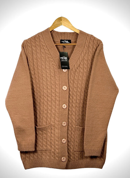 Cozy&Drape brown cable knit cardigan sweater with long sleeves, front buttons, and two pockets on a wooden hanger