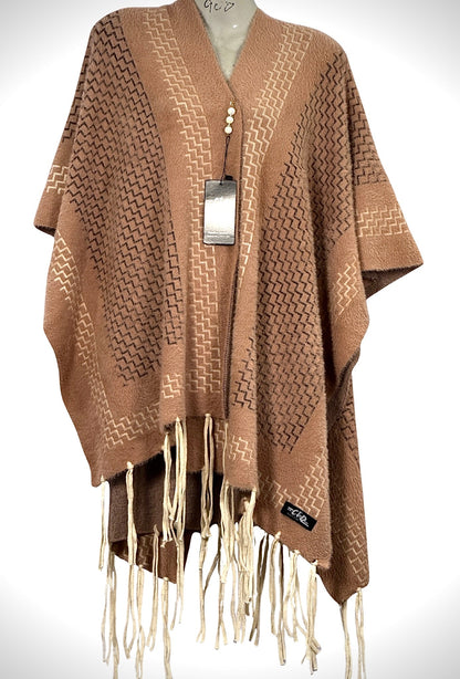 Cozy&Drape brown winter cape shawl with geometric zigzag pattern and cream fringe trim on a mannequin