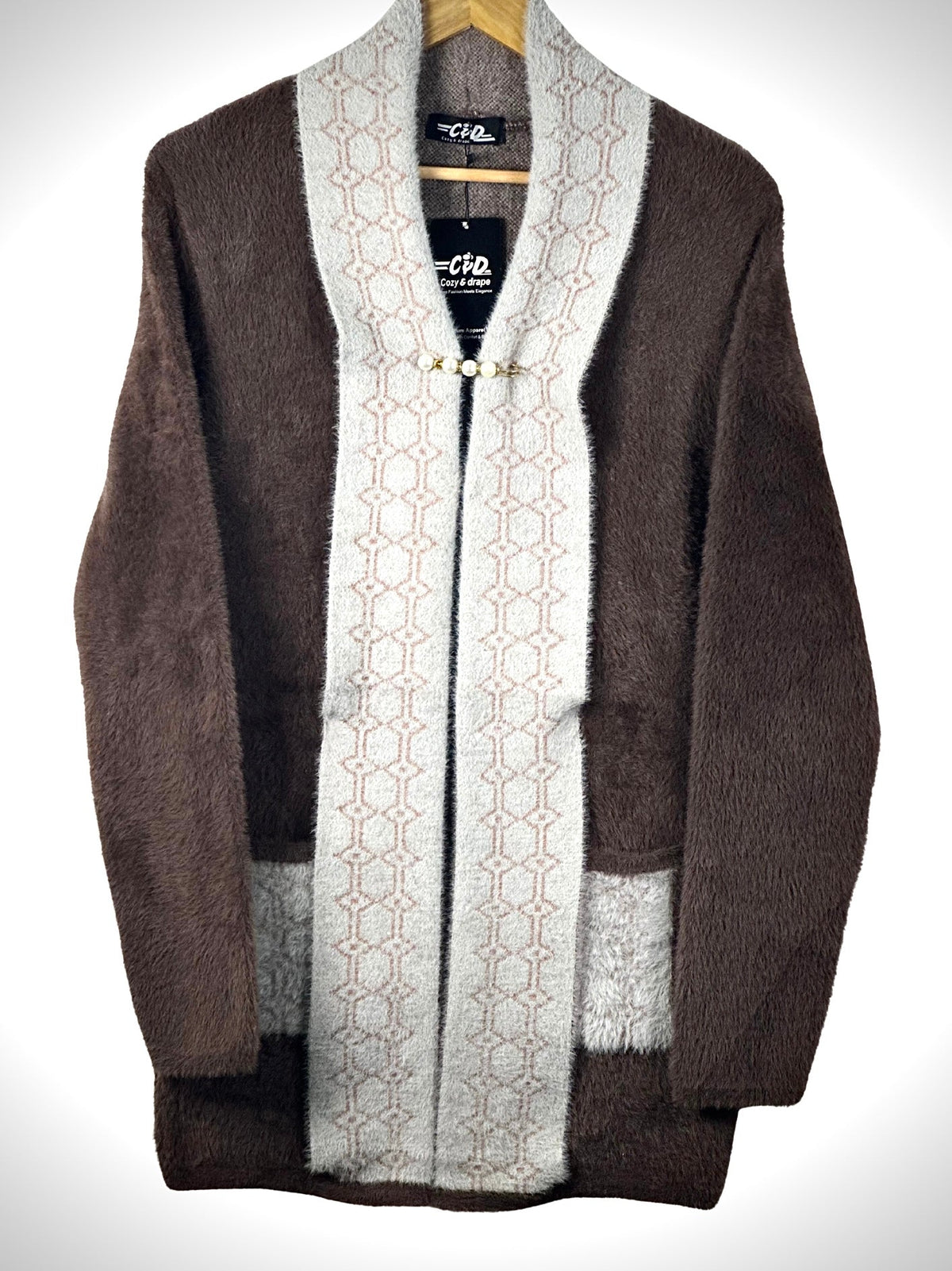 Cozy&Drape open front sweater in brown and beige with a geometric patterned trim and front pockets