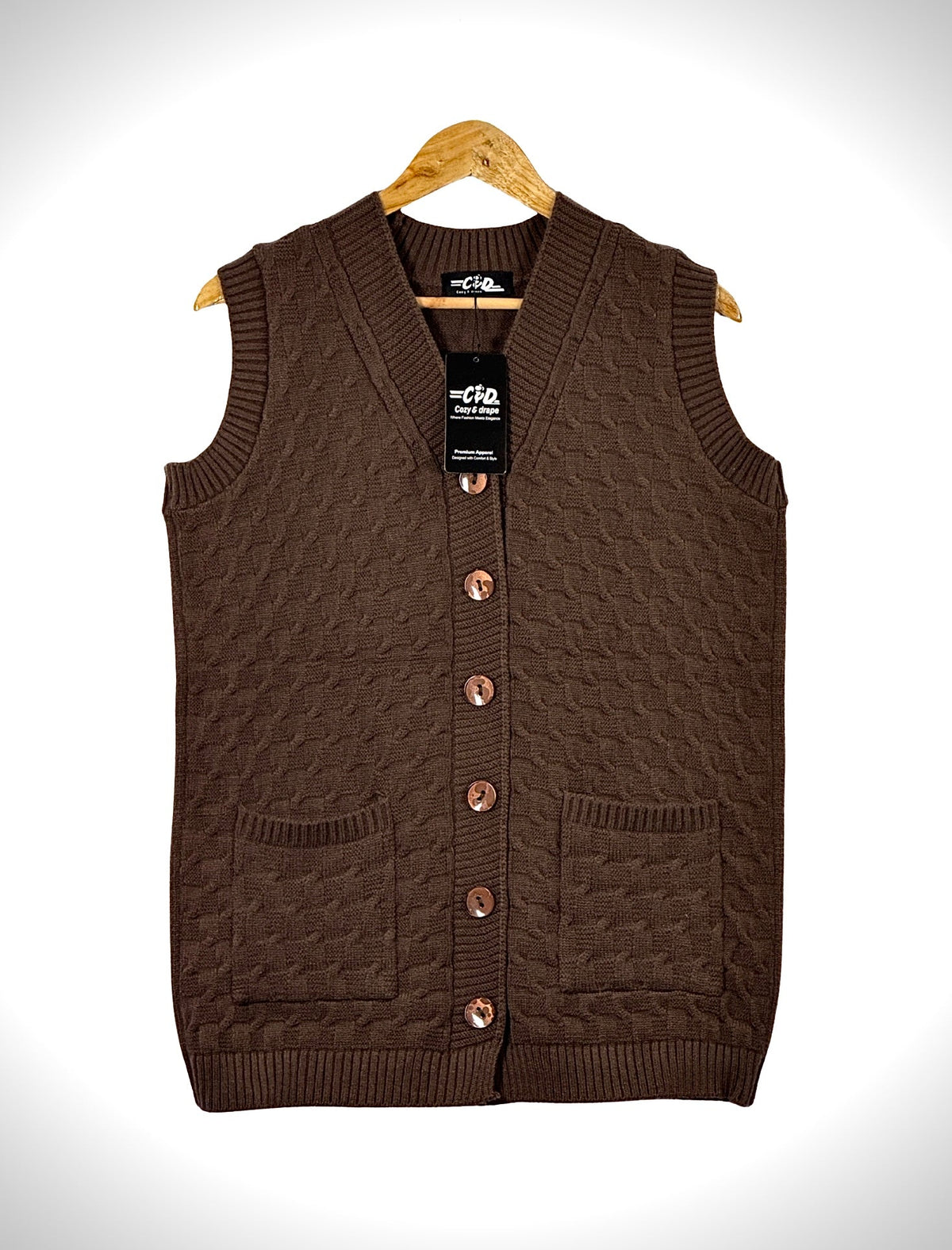 Cozy&Drape brown sleeveless cardigan sweater with a cable knit texture, V-neck, button front, and two front pockets.
