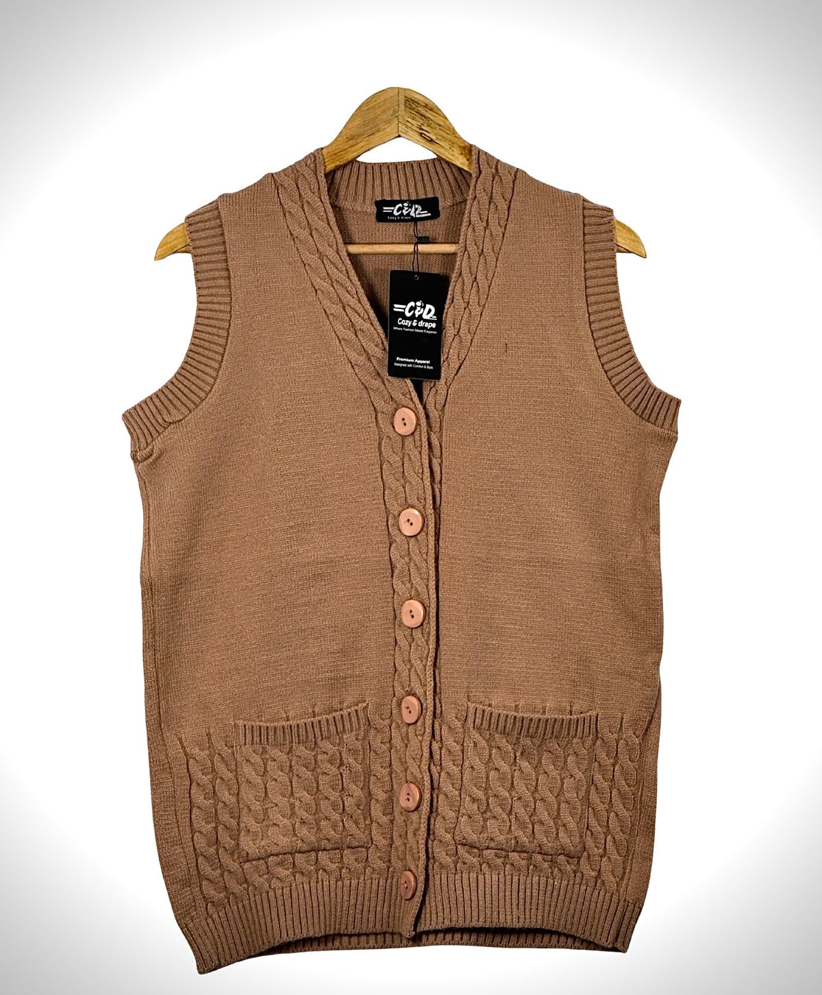 Cozy&Drape brown sleeveless cardigan sweater with a V-neck, button front, and cable knit pocket details.