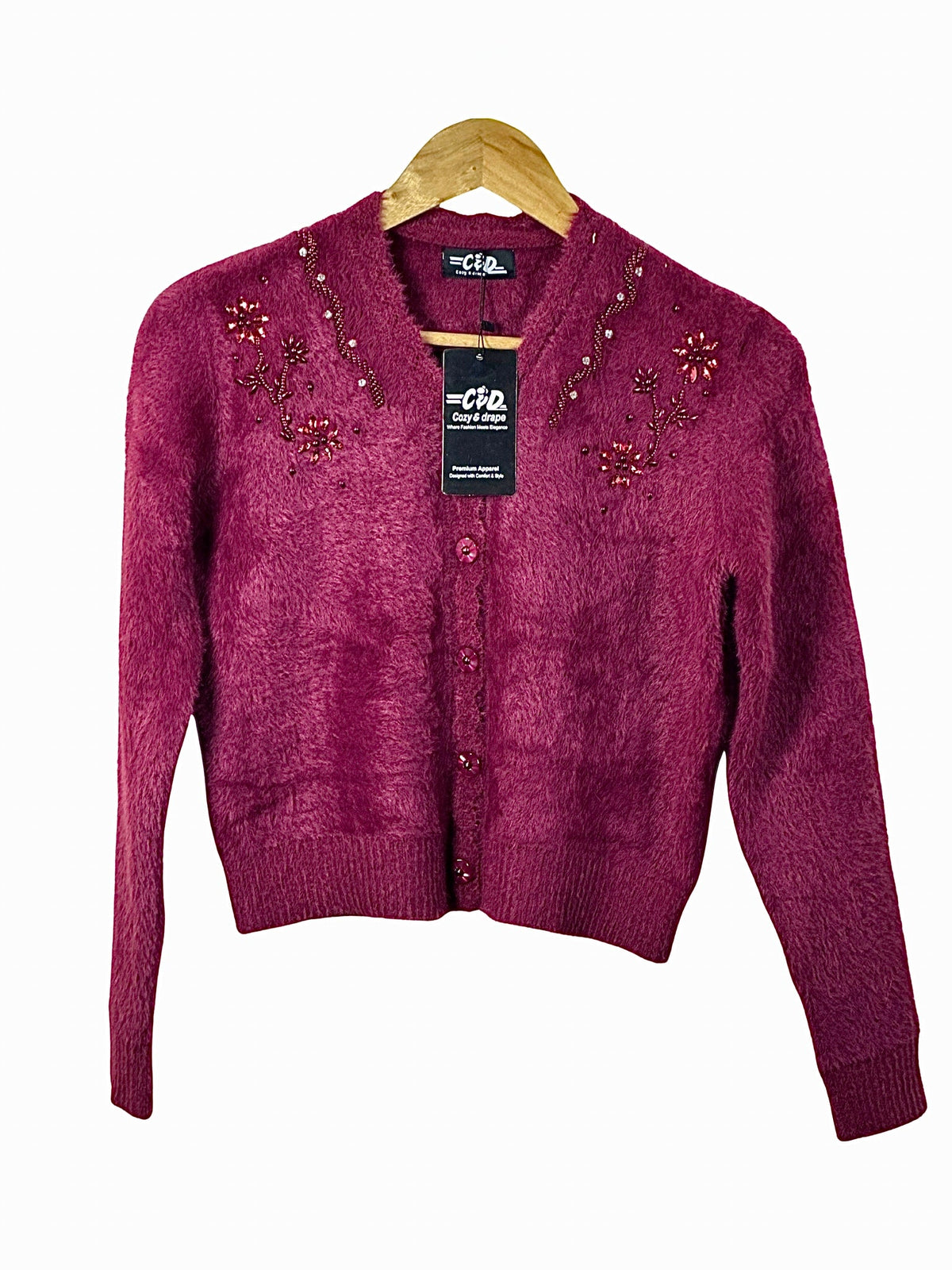 Cozy&Drape extra short burgundy cardigan sweater with beaded floral embroidery and button-up front on a wooden hanger