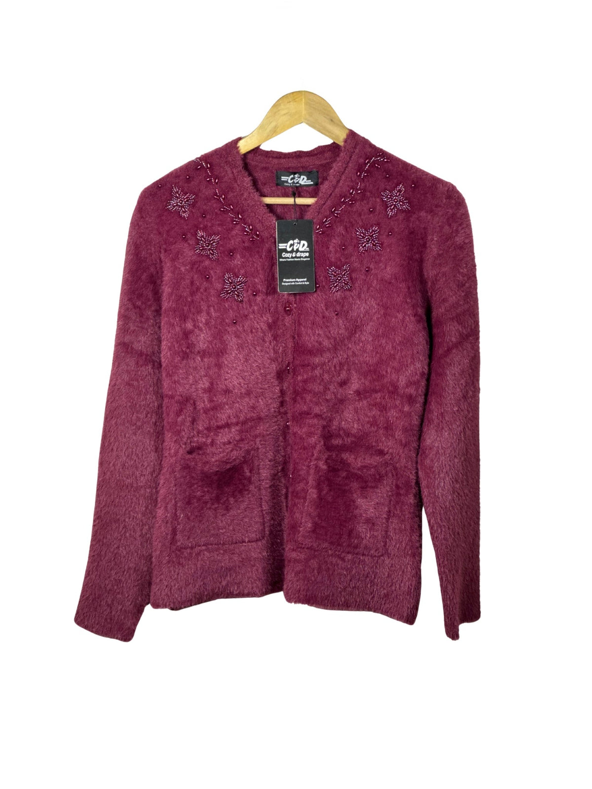 Cozy&Drape burgundy fuzzy cardigan sweater with beaded floral embroidery and front pockets on a wooden hanger