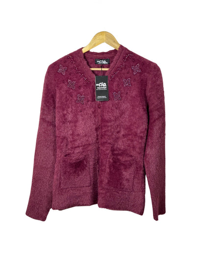Cozy&Drape burgundy fuzzy cardigan sweater with beaded floral embroidery and front pockets on a wooden hanger