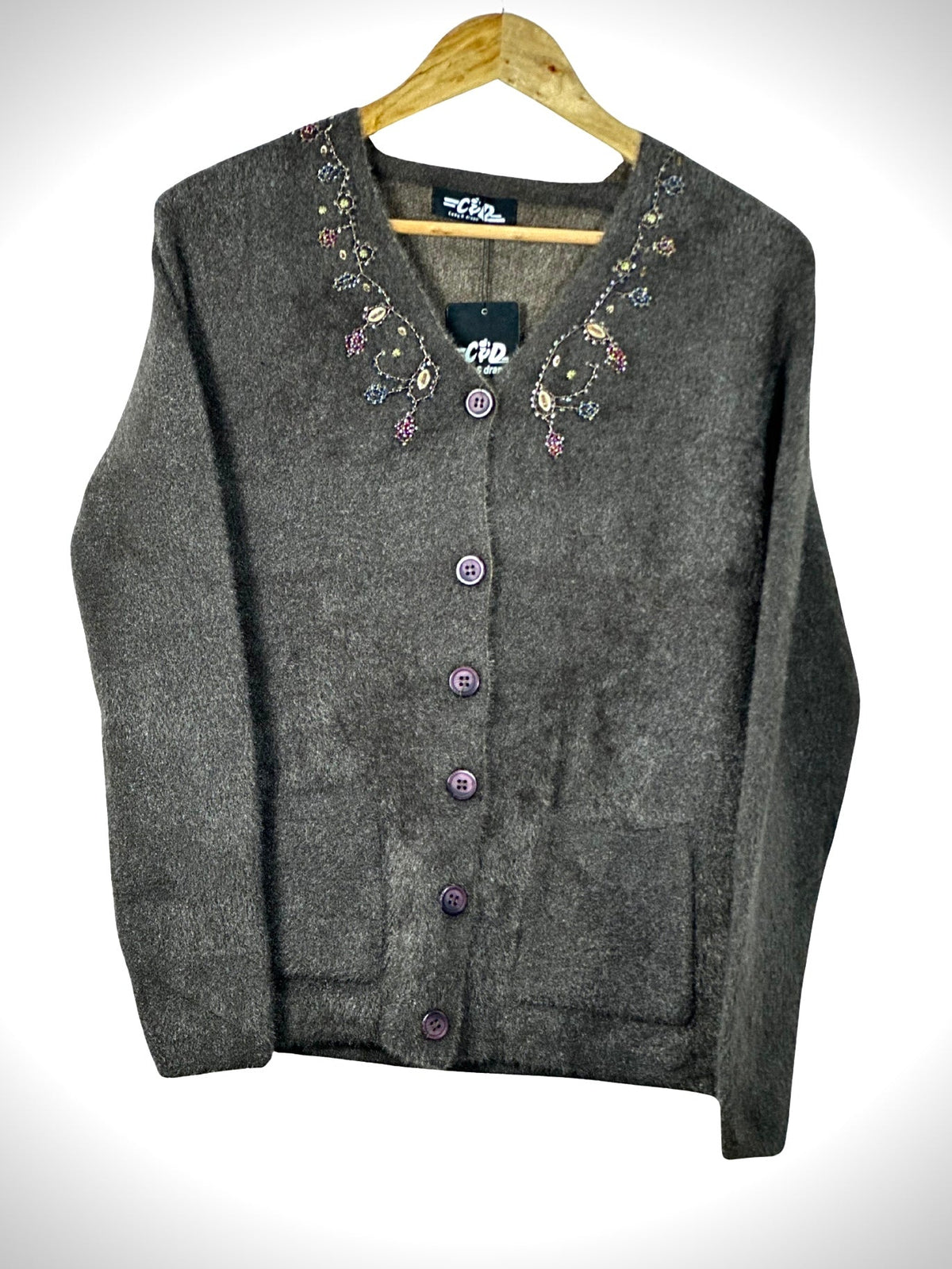 Cozy&Drape charcoal grey button-up cardigan sweater with floral beadwork embroidery on the neckline and front pockets.