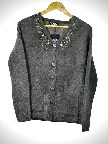 Cozy&Drape charcoal grey button-up cardigan sweater with floral beadwork embroidery on the neckline and front pockets.