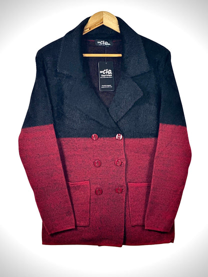 Cozy&Drape double-breasted knit blazer in black and red color-block with notched lapels and two front patch pockets.