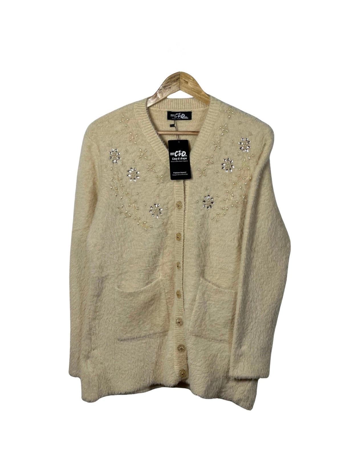 Cozy&Drape cream full sleeve cardigan sweater with floral bead embellishments, front pockets, and button closure.
