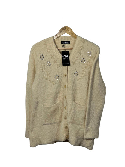 Cozy&Drape cream full sleeve cardigan sweater with floral bead embellishments, front pockets, and button closure.
