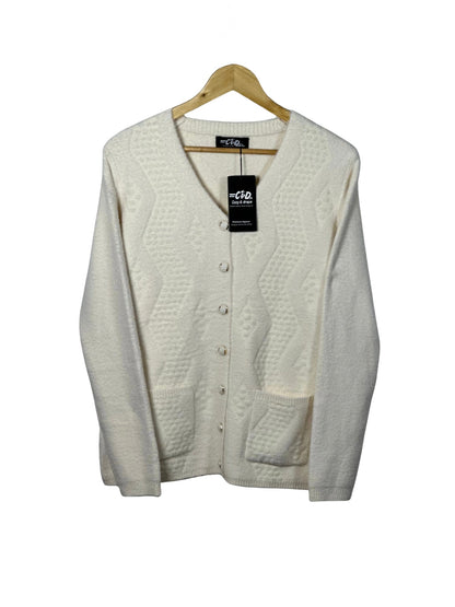 Cozy&Drape cream button-up cardigan sweater with textured geometric pattern and front pockets on a wooden hanger