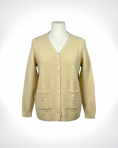Cozy&Drape cream V-neck button-down cardigan with cable-knit detailing and two front patch pockets on a mannequin.