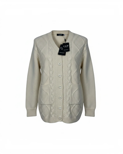 Cozy&Drape cream cable-knit cardigan with V-neck, button-down front, and two front pockets on a white background.
