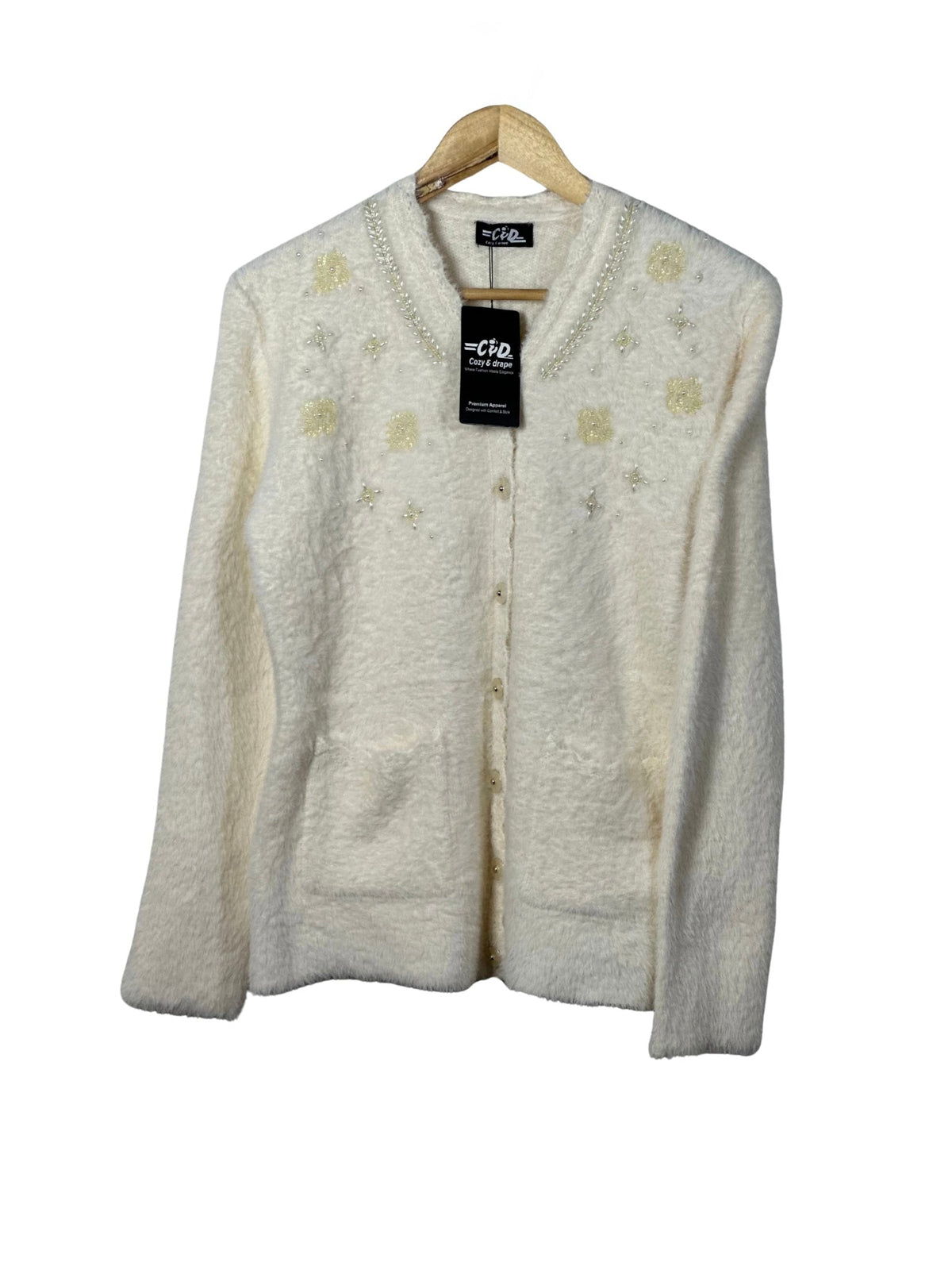 Cozy&Drape cream fuzzy cardigan sweater with pearl and sequin floral embellishments, long sleeves, and front pockets.