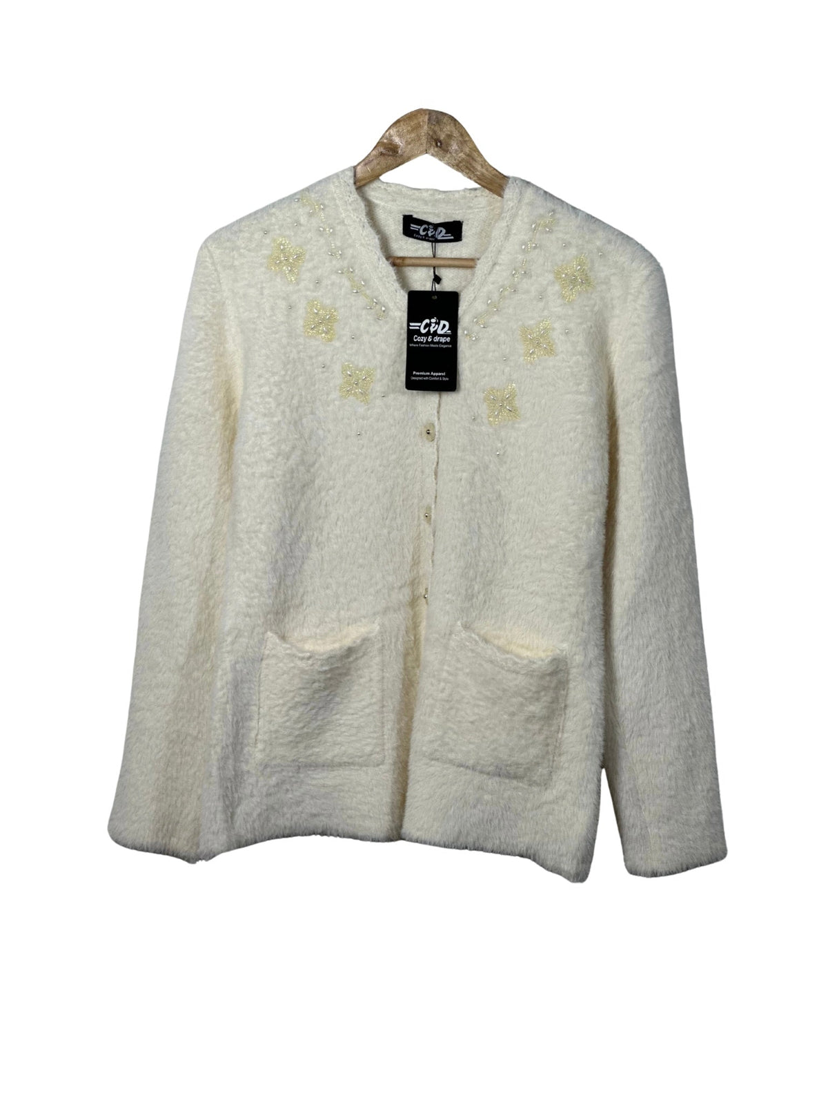 Cozy&Drape cream fuzzy cardigan sweater with beaded floral embroidery, front pockets, and button-up closure.