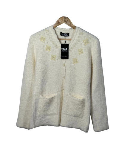 Cozy&Drape cream fuzzy cardigan sweater with beaded floral embroidery, front pockets, and button-up closure.