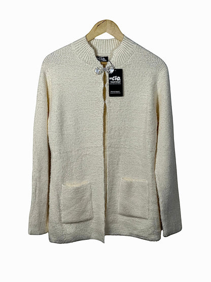 Cozy&Drape cream open-front knit cardigan sweater with long sleeves and two front pockets on a wooden hanger